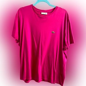 Fuchsia or pink Men’s Lacoste shirt.